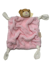 A plush pink comforter with a bear design, featuring a teddy bear head and arms, made by Kaloo.